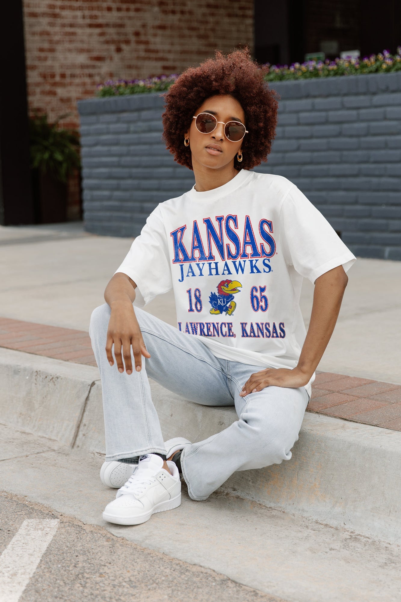 Ivory Kansas Jayhawks Unity Oversized Crewneck Tee - Seated Campus Lifestyle Shot with Flare Jeans | Gameday Couture - SOHO