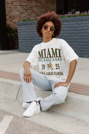 Ivory Miami Hurricanes Unity Oversized Crewneck Tee - On Model Seated with Light Wash Jeans | Gameday Couture - SOHO