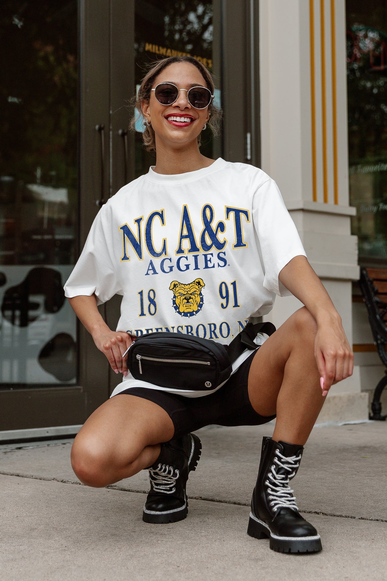 White NC A&T Aggies Unity Oversized Tee - Crouching Pose on Model | Gameday Couture - SOHO