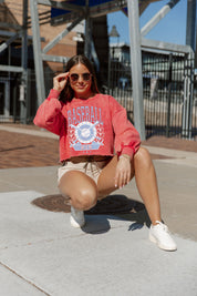 Red UNDER THE STADIUM LIGHTS VINTAGE WASHED CROP SWEATSHIRT - Model Crouching | Gameday Couture - SOHO