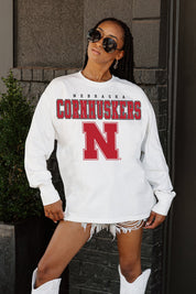 White Nebraska Cornhuskers Big Goals Oversized Long Sleeve Tee - Close-Up Front Logo Detail | Gameday Couture - SOHO